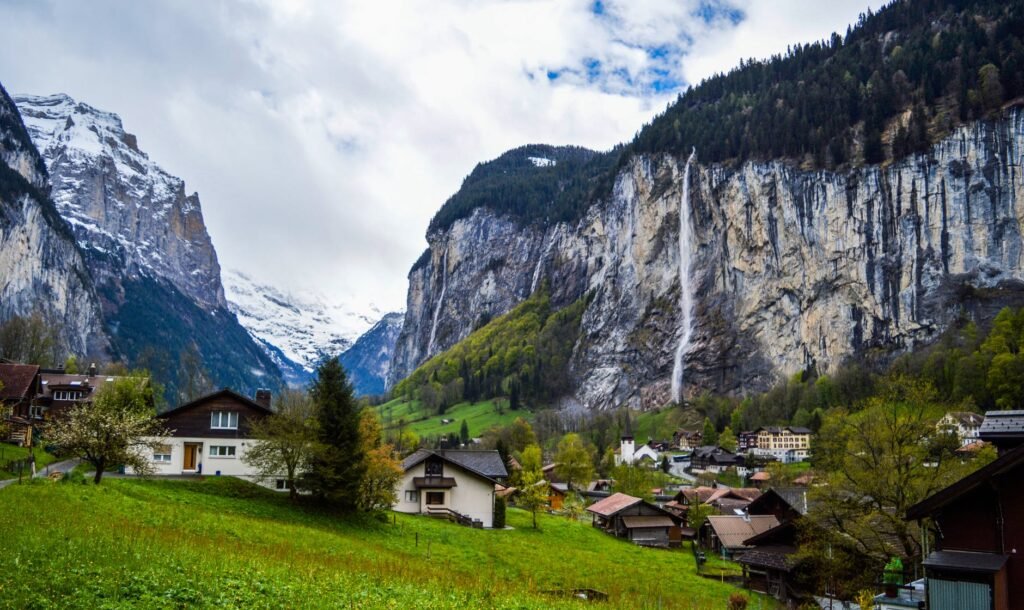 mountainous countryside with chalets and fresh vegetation