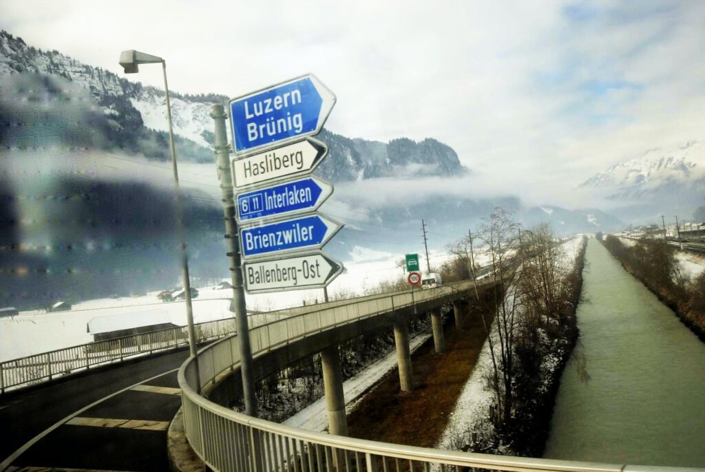 road sign post under the cloudy sky