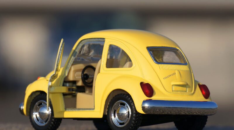 yellow volkswagen beetle die cast on floor