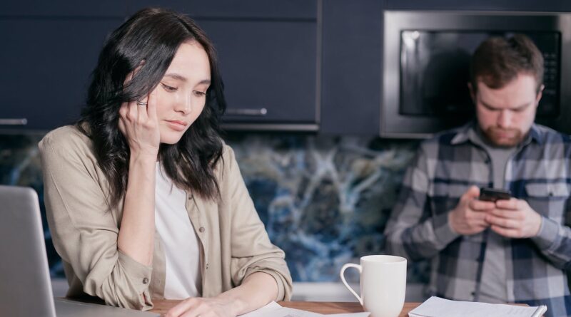stressed woman looking at documents