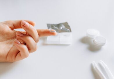 close up photo of contact lens on finger