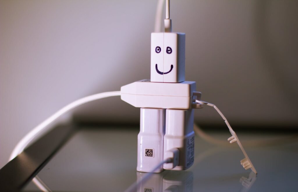 four white travel adapters