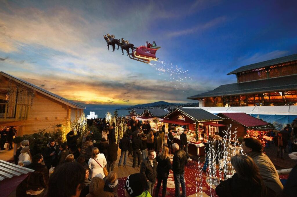 Papa Noel sobrevolando el mercadillo de Navidad en Montreux, Suiza
